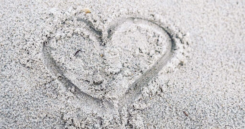 heart drawn in sand