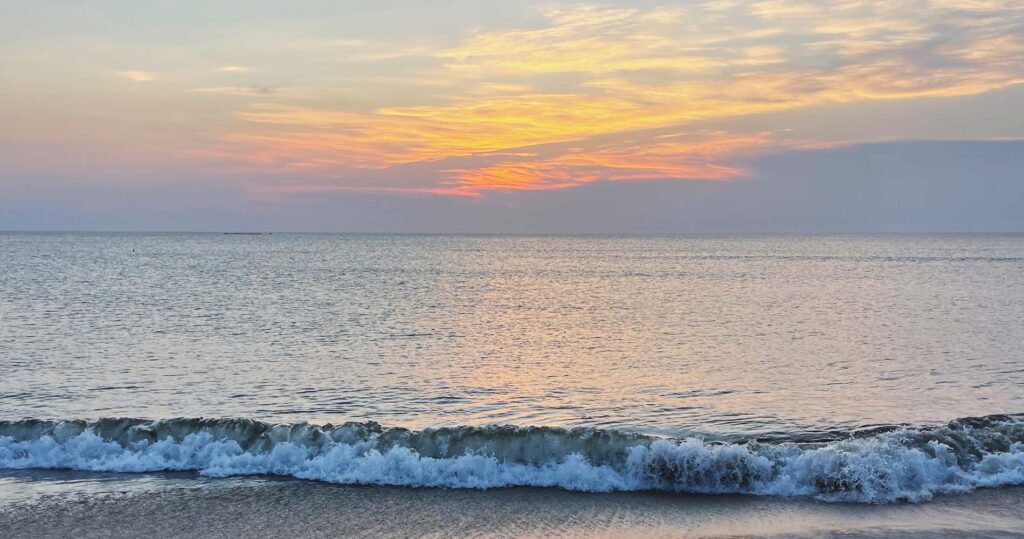 sunrise over ocean waves